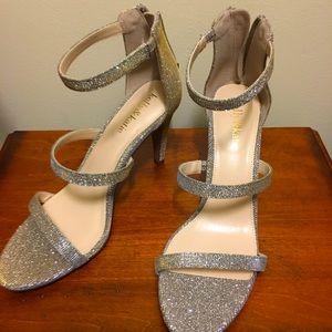 Metallic strappy heels with gold back zippers. Mix of silver/gold.